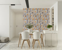 Warm Meadow Harmony wallpaper of amber and grey meadow flowers in a dining area with white chairs