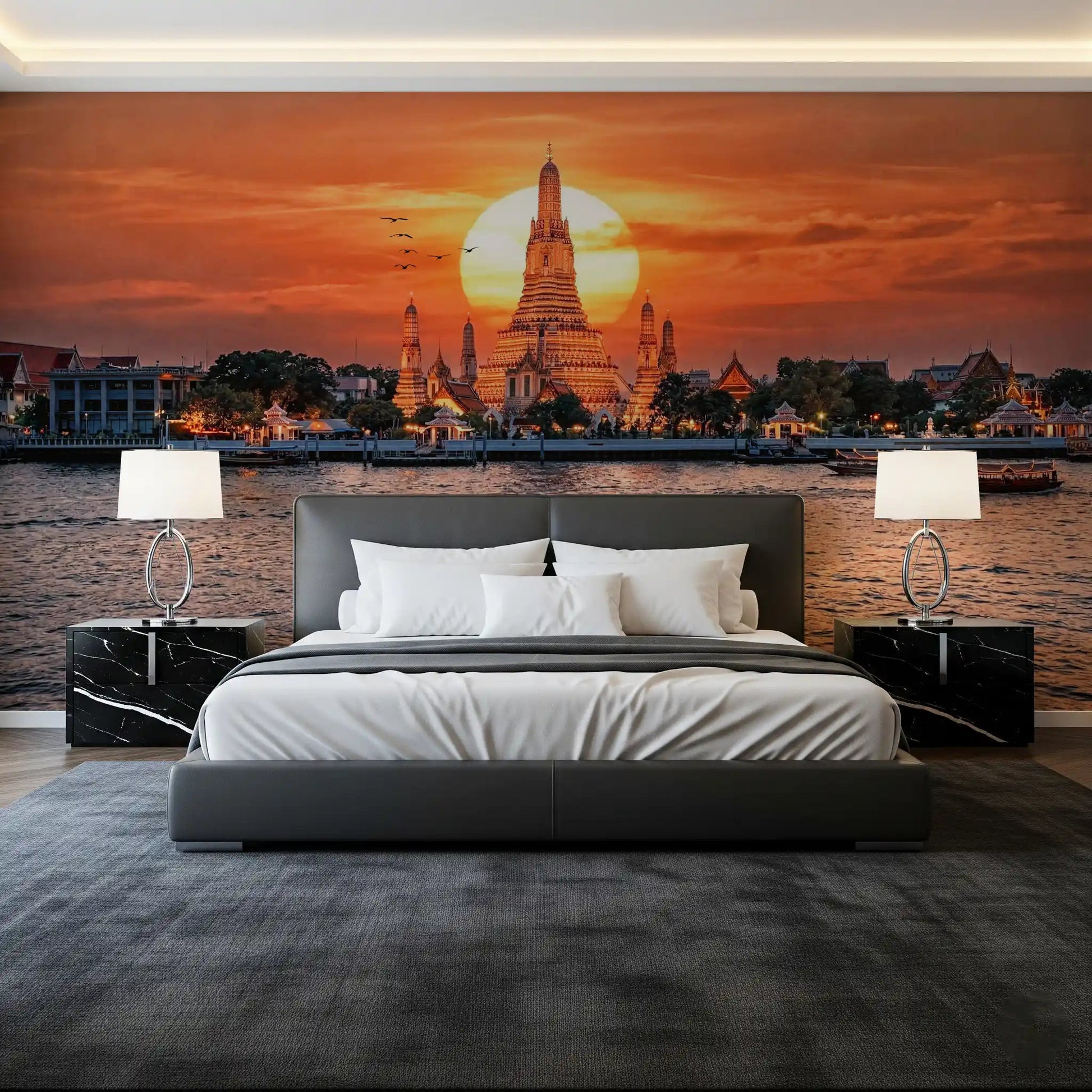 Bedroom with Wat Arun sunset wall mural and orange river glow
