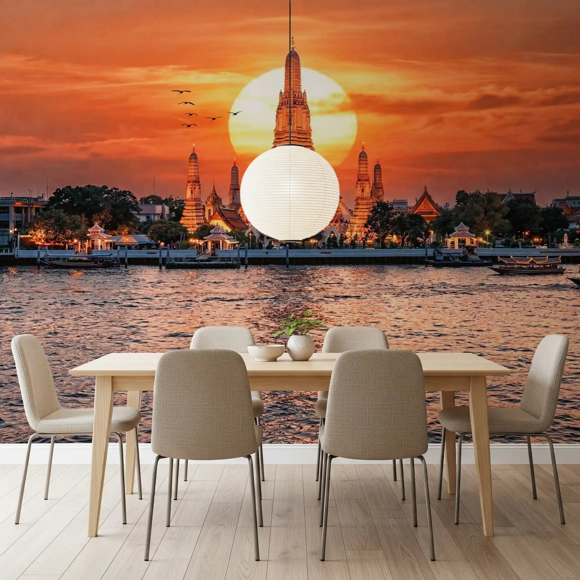 Dining room with river sunset wall mural and temple silhouette