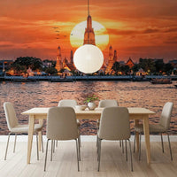 Dining room with river sunset wall mural and temple silhouette
