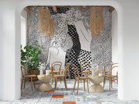 Water Serpents wallpaper mural behind bentwood chairs and rattan pendants in a tiled cafe lounge