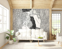 Water Serpents wallpaper mural in black and white behind a white sofa under a wood-beam ceiling