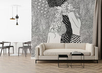 Water Serpents wallpaper mural of two women behind a cream sofa with black nesting tables