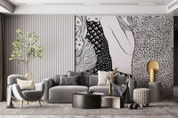 Water Serpents wallpaper mural beside a fluted wall above a gray sofa and gold side table
