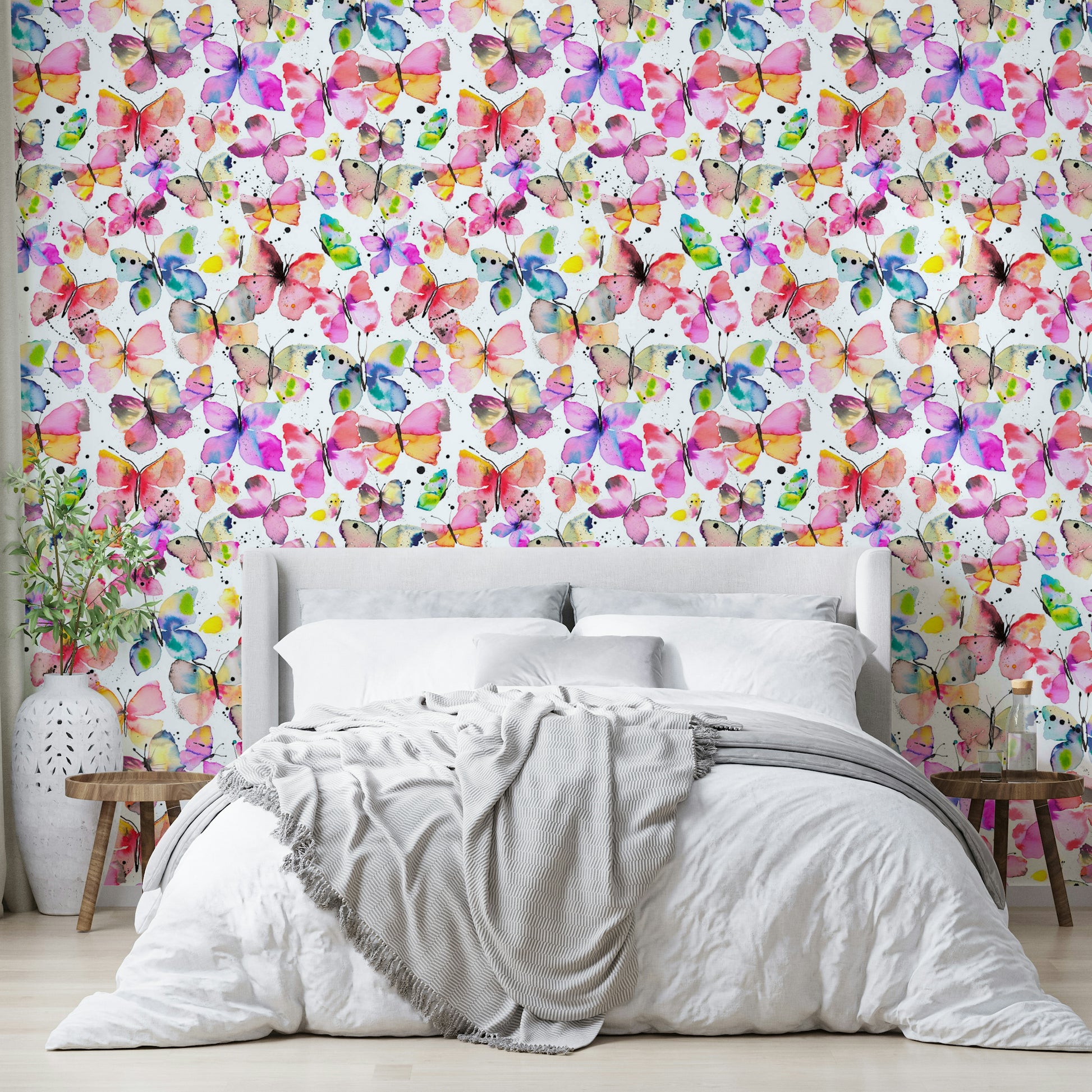 Close-up of watercolor butterflies with fine brushstrokes.

