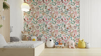 Watercolor flower design in bright orange and soft green hues.

