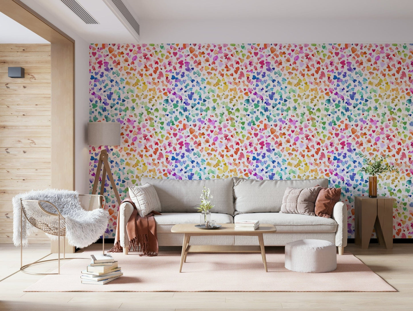 Modern boho nursery with heart print wallpaper and natural wood.