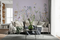 A floral wallpaper with hand-painted wildflowers rising gracefully from the bottom of the mural.