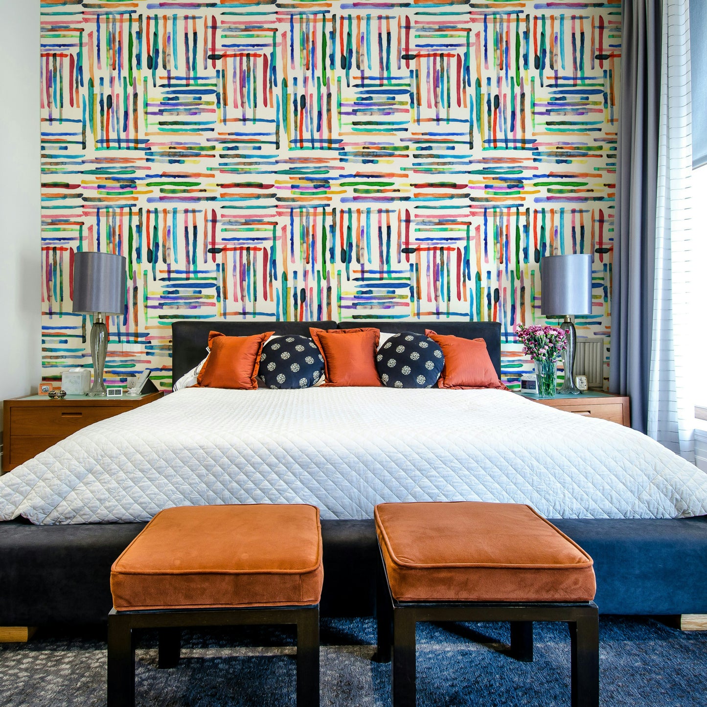 Coastal-inspired wallpaper with watercolor blue stripe tiles.

