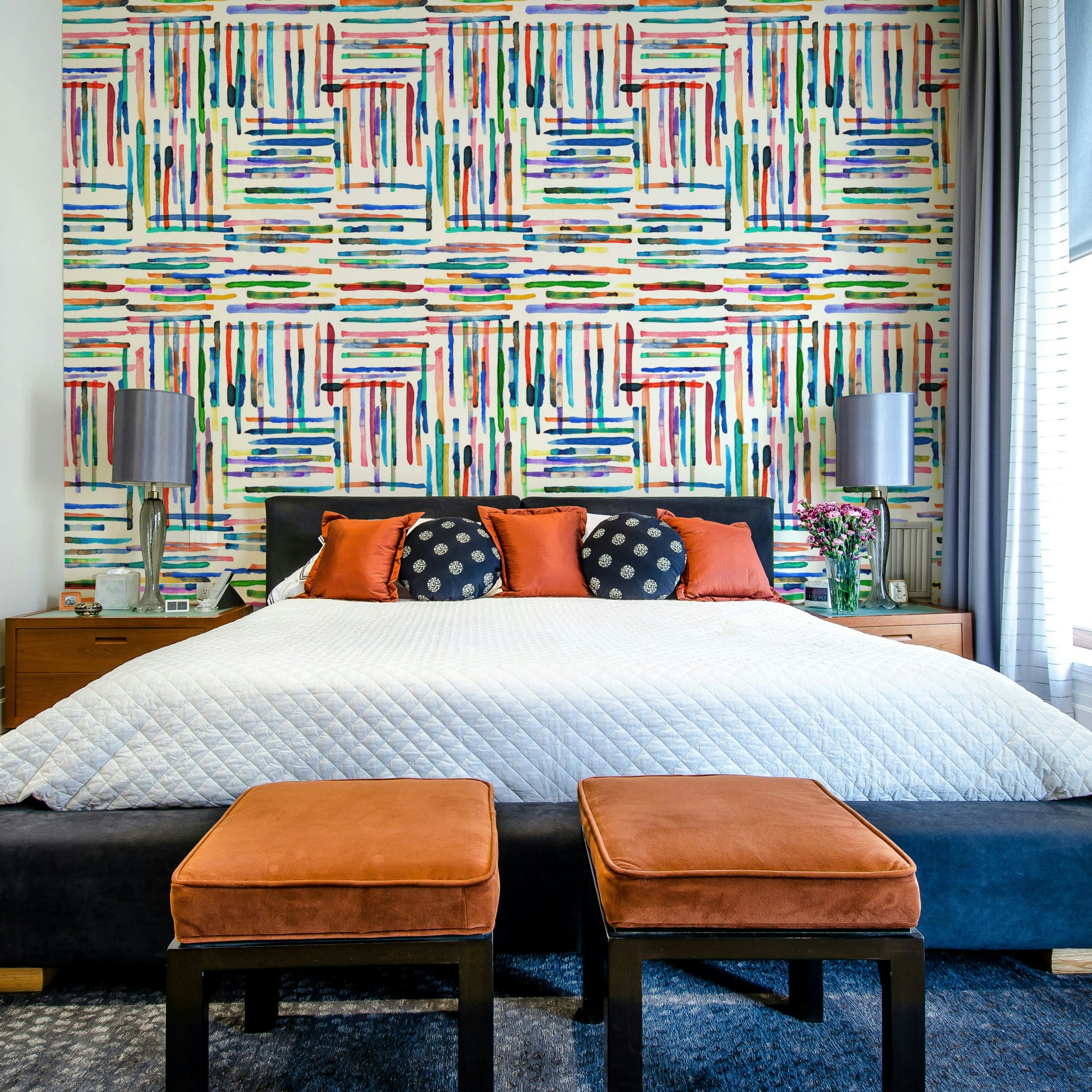 Coastal-inspired wallpaper with watercolor blue stripe tiles.

