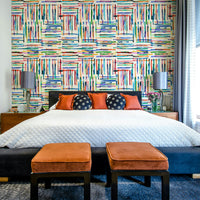 Coastal-inspired wallpaper with watercolor blue stripe tiles.

