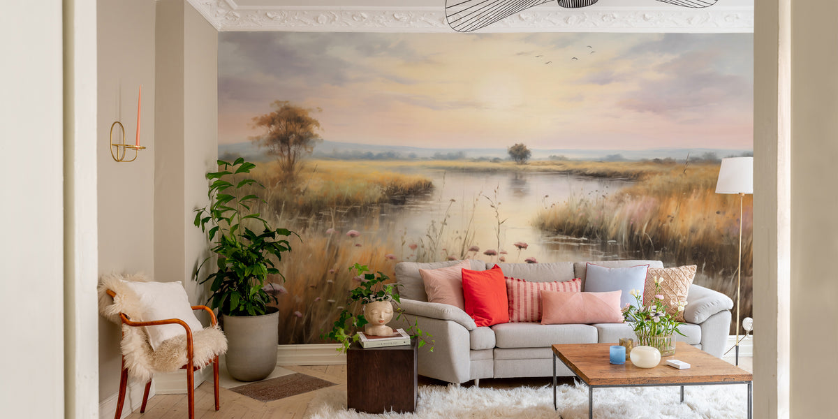 Watercolor Wetlands Landscape Lake wallpaper mural of a calm sunset lake behind a grey sofa with coral pillows