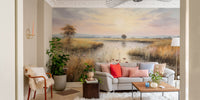 Watercolor Wetlands Landscape Lake wallpaper mural of a calm sunset lake behind a grey sofa with coral pillows