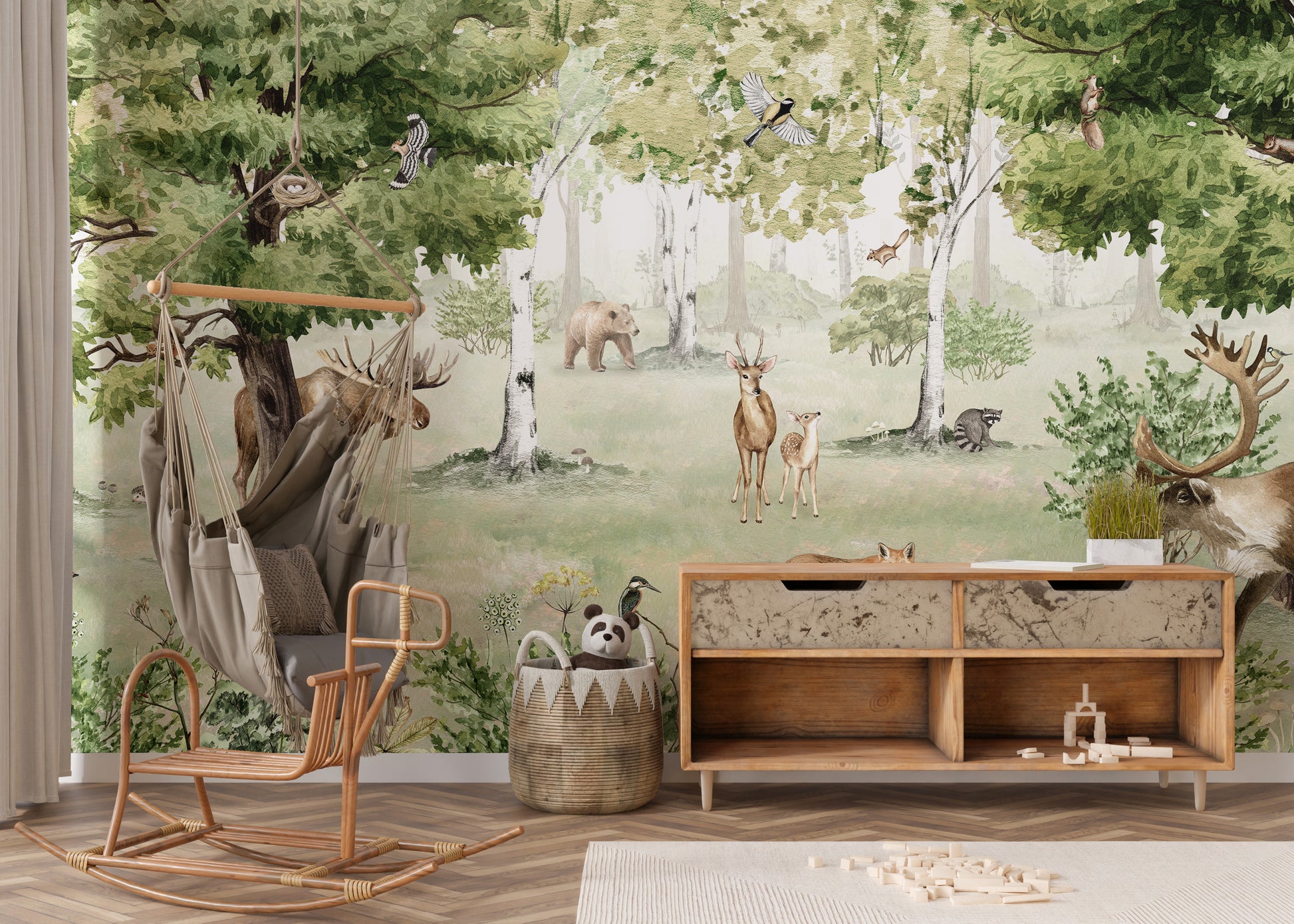 Watercolor Woodland Wonders wallpaper mural of moose and deer in a forest behind a rattan hanging chair and wood console
