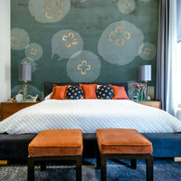 Jellyfish in watercolor tones with gold accents on petrol background.

