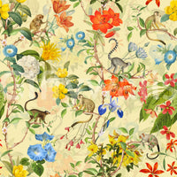 Wallpaper with monkeys perched on branches surrounded by exotic greenery.

