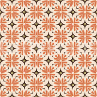 Bold orange geometric wallpaper with a boho floral design.

