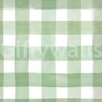 Close-up of watercolor gingham checks in calm green tones.

