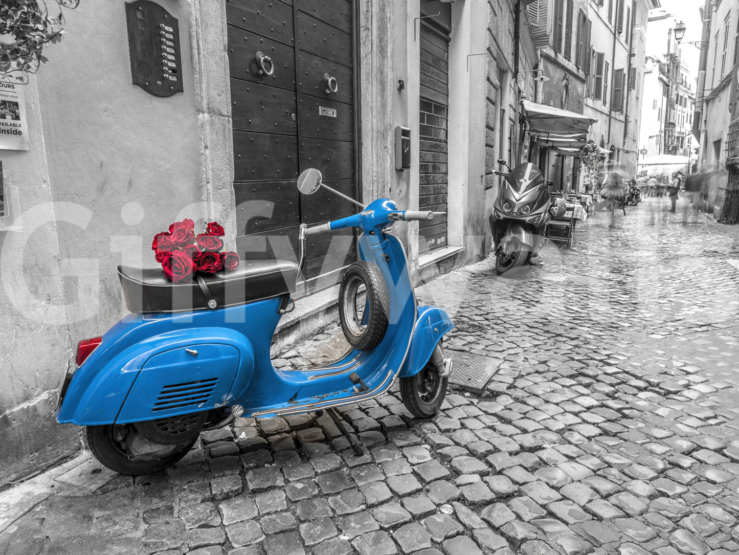 The image captures the unique style of a vintage scooter.

