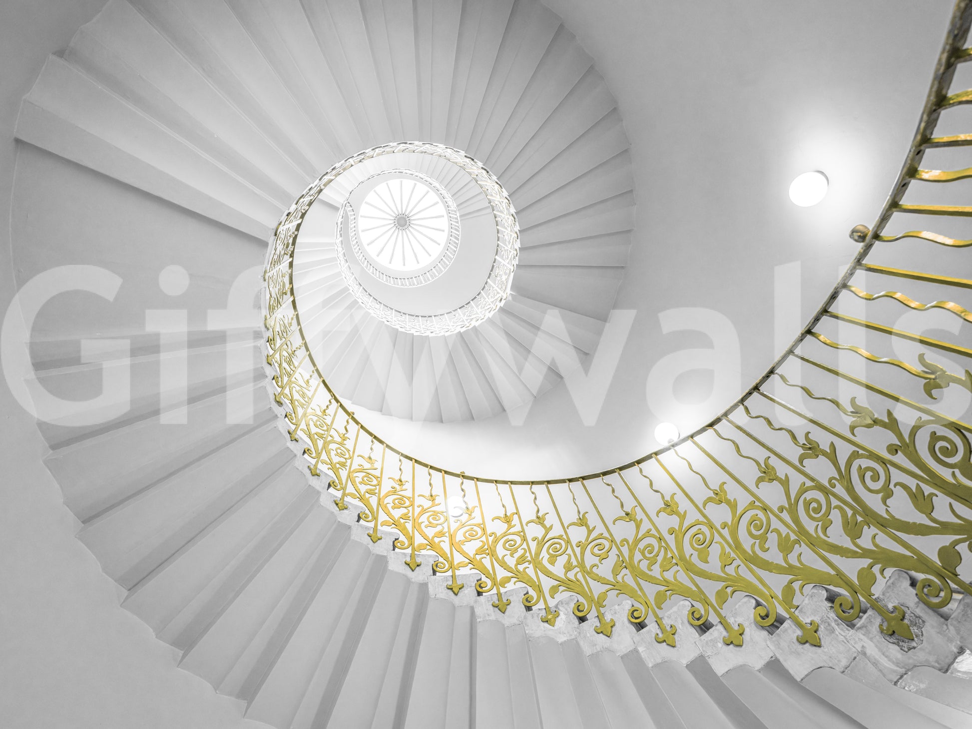 A dining area with the spiral staircase wall mural as a focal point.

