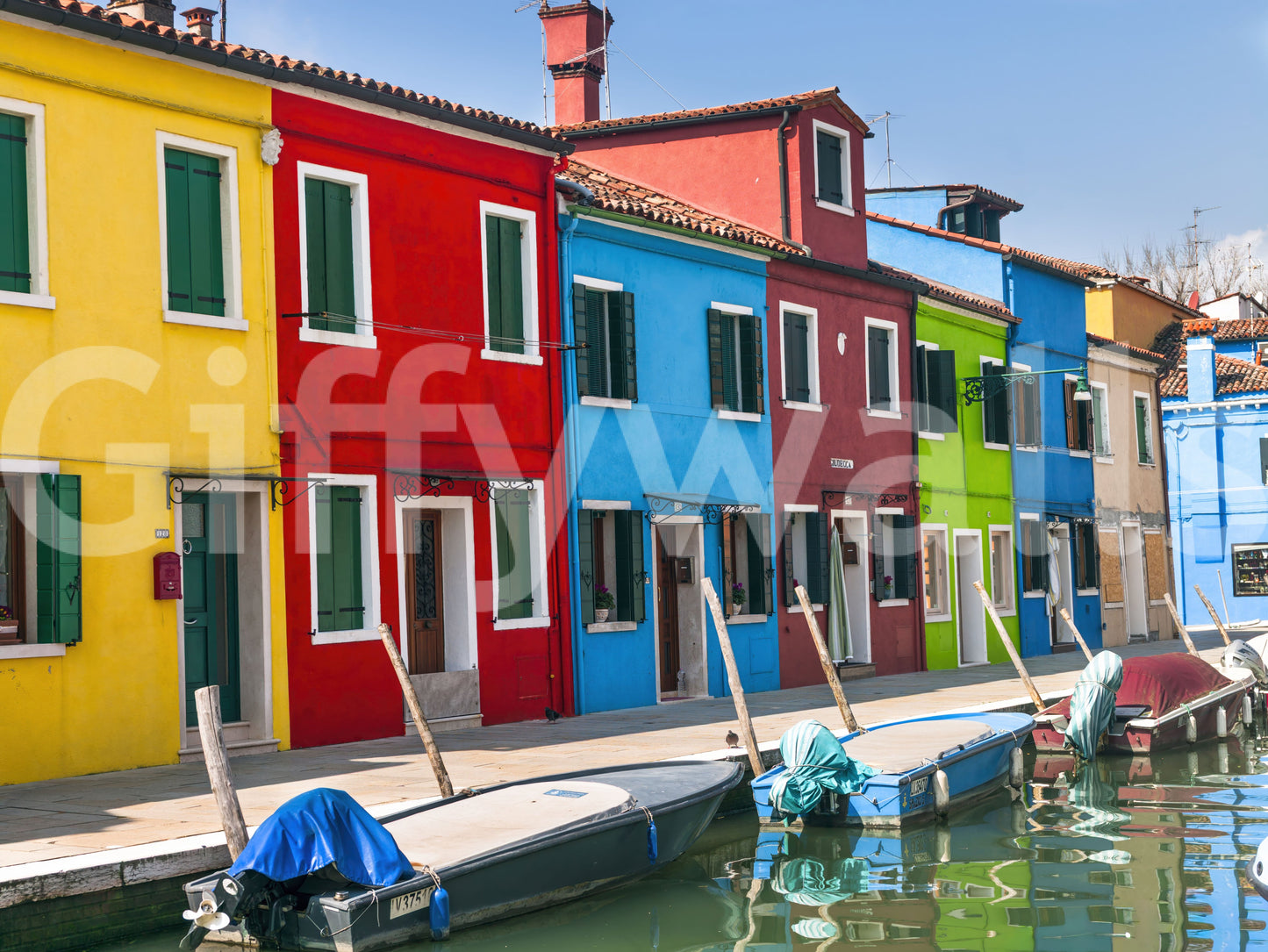Colorful wall mural covering, unique facade composition, delightful Italian feel.