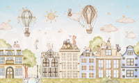 Cartoon city wall mural with cats, skyline, and light color palette