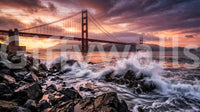 Golden Gate sunset wall mural with crashing waves and rocky coastal foreground