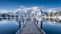 Snowy alpine lake wall mural with wooden dock and crisp mountain reflections