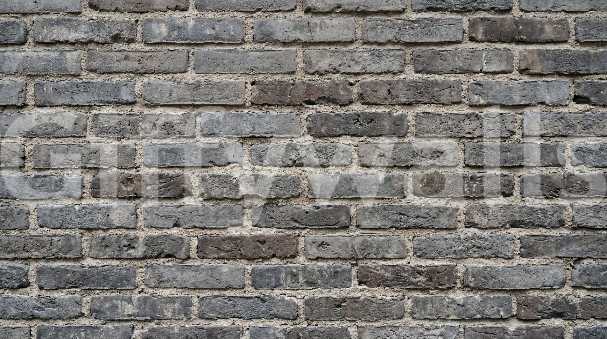 Textured brick wall mural in urban gray with a worn masonry finish