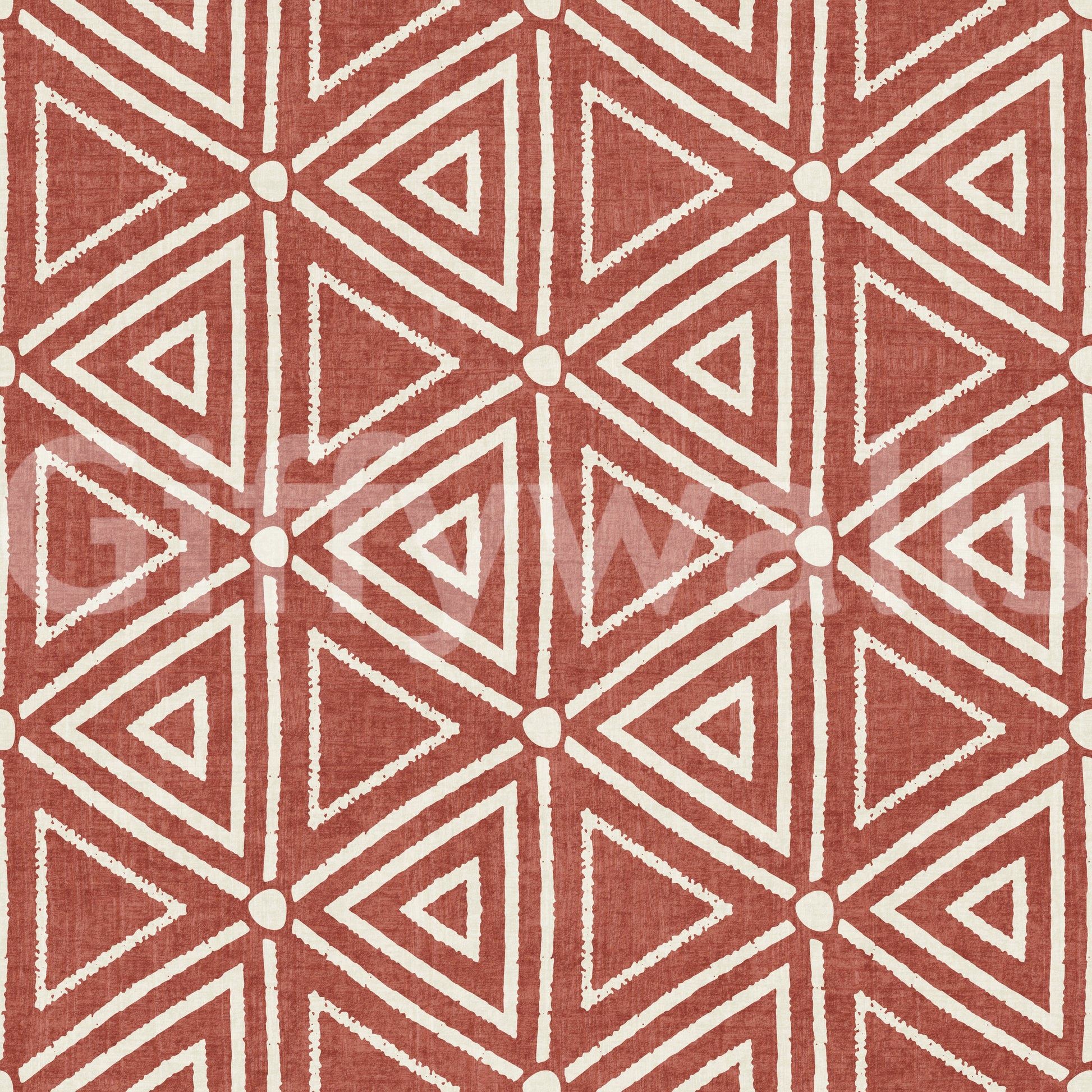 Block-stamped tribal triangles forming the terracotta wallpaper pattern
