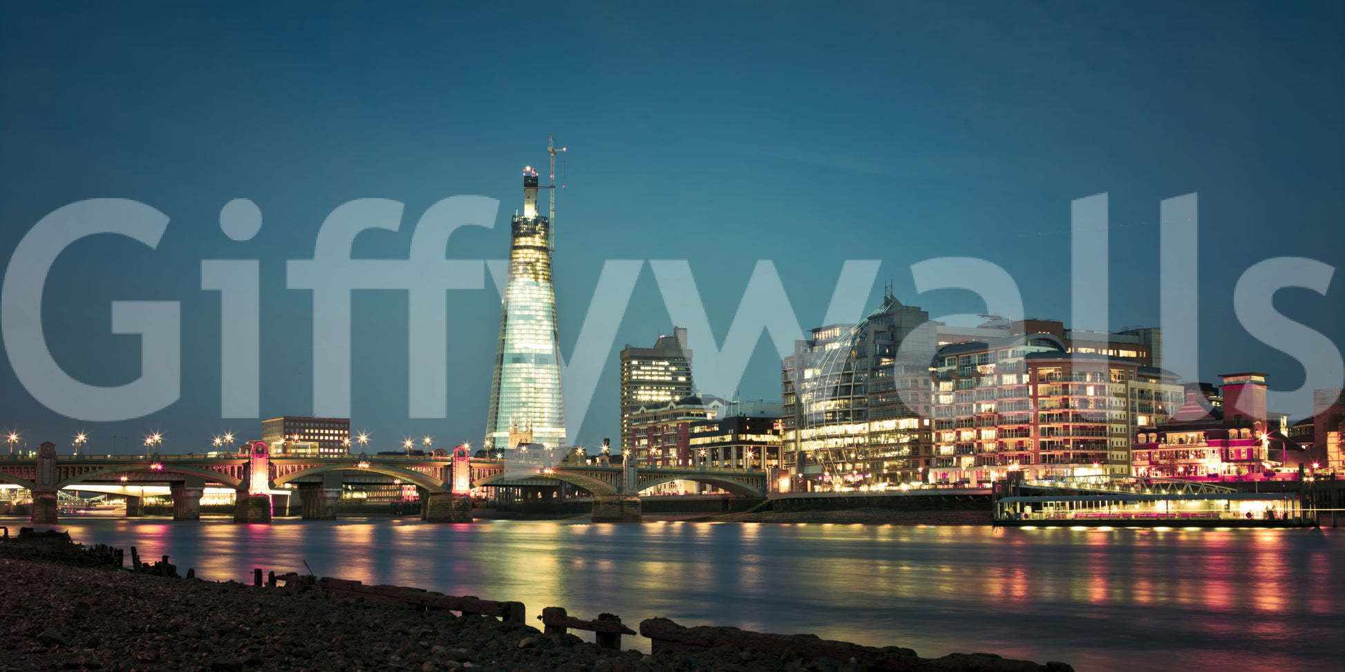 Reflections of building lights spread low on the river in this Skyline wall mural