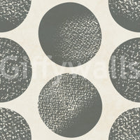 Soft stippling gives this grey and cream wallpaper a relaxed graphic look