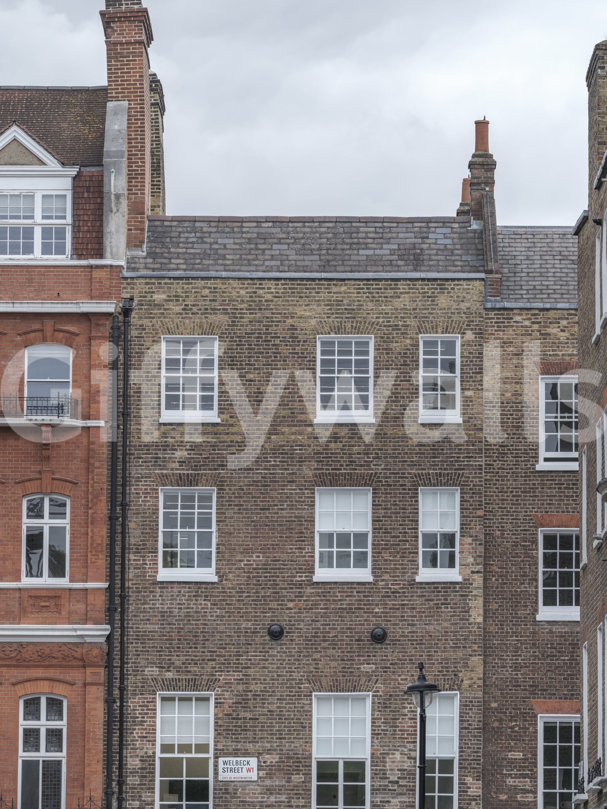Urban architecture wall mural with detailed townhouse fronts