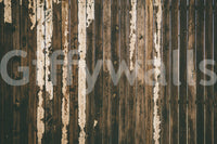 Weathered Wood wallpaper mural close-up showing dark brown vertical planks with peeling pale paint streaks