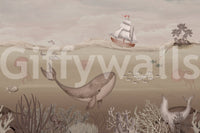 Whale swimming through calm ocean mural on living room feature wall.