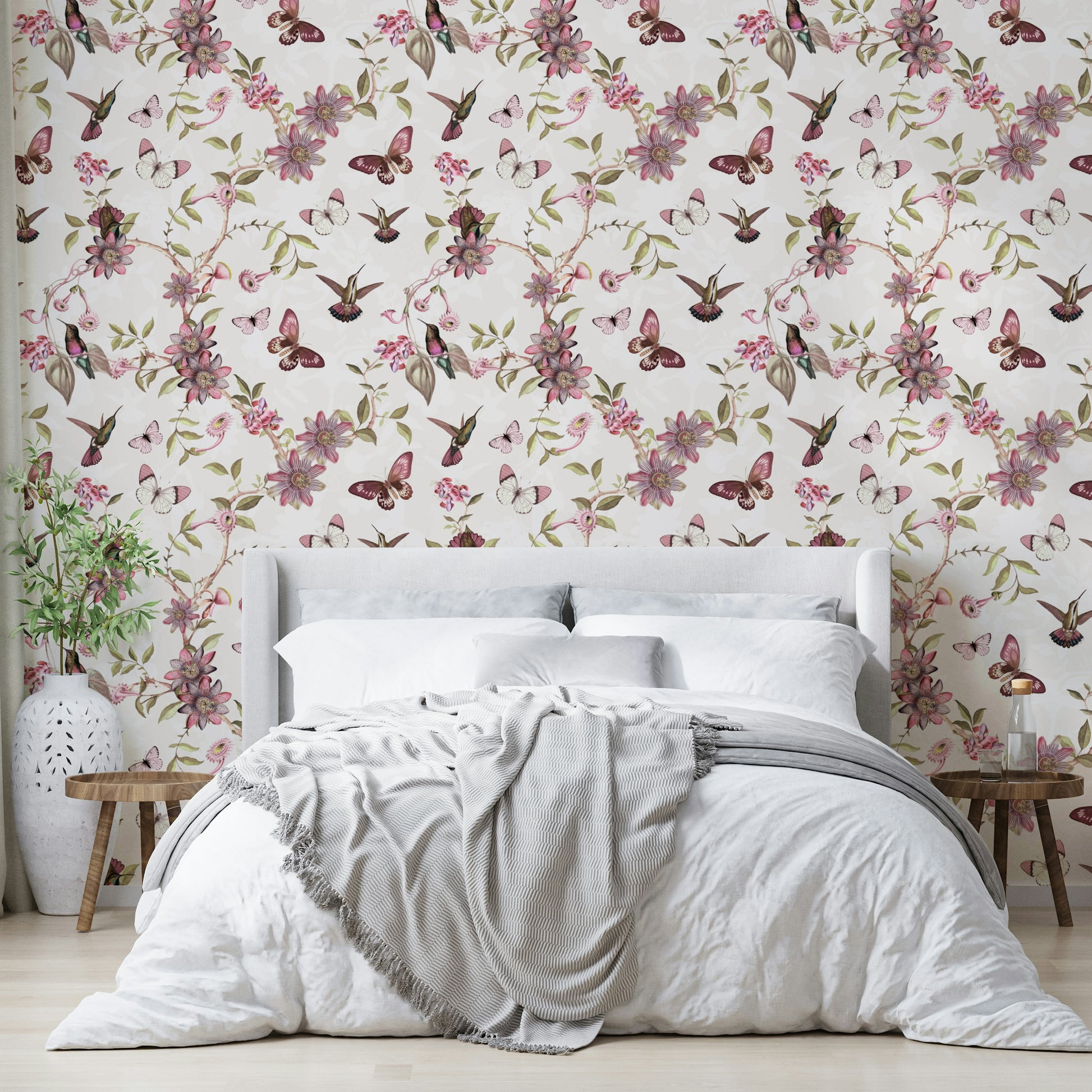 Close-up of butterflies and blossoms on a pale background.

