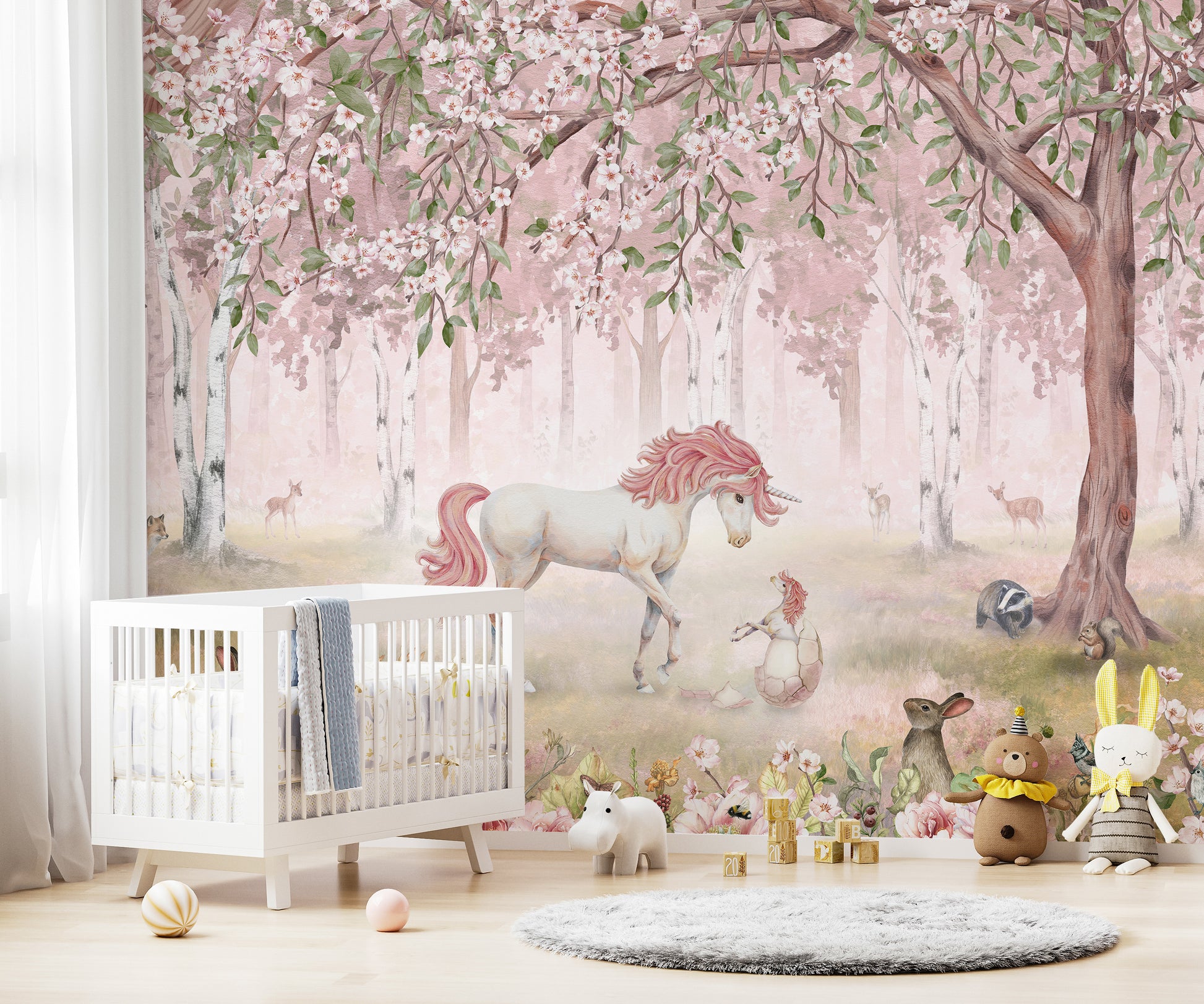 Temporary Unicorn Forest Pink Wall Mural in a nursery featuring a white crib and a soft round rug on the floor.