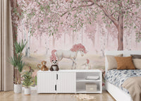 Self adhesive Unicorn Forest Pink Wall Mural in a bedroom featuring a white bed with grey pillows and a tall plant.