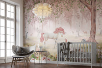 Premium Unicorn Forest Pink Wall Mural in a nursery with a sleek grey crib and a decorative cloud pendant light.