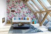 Floral watercolor mural featuring soft pink roses and delicate greenery.

