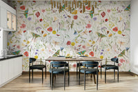The image shows a full wall with several large flowers on a dark, moody background.

