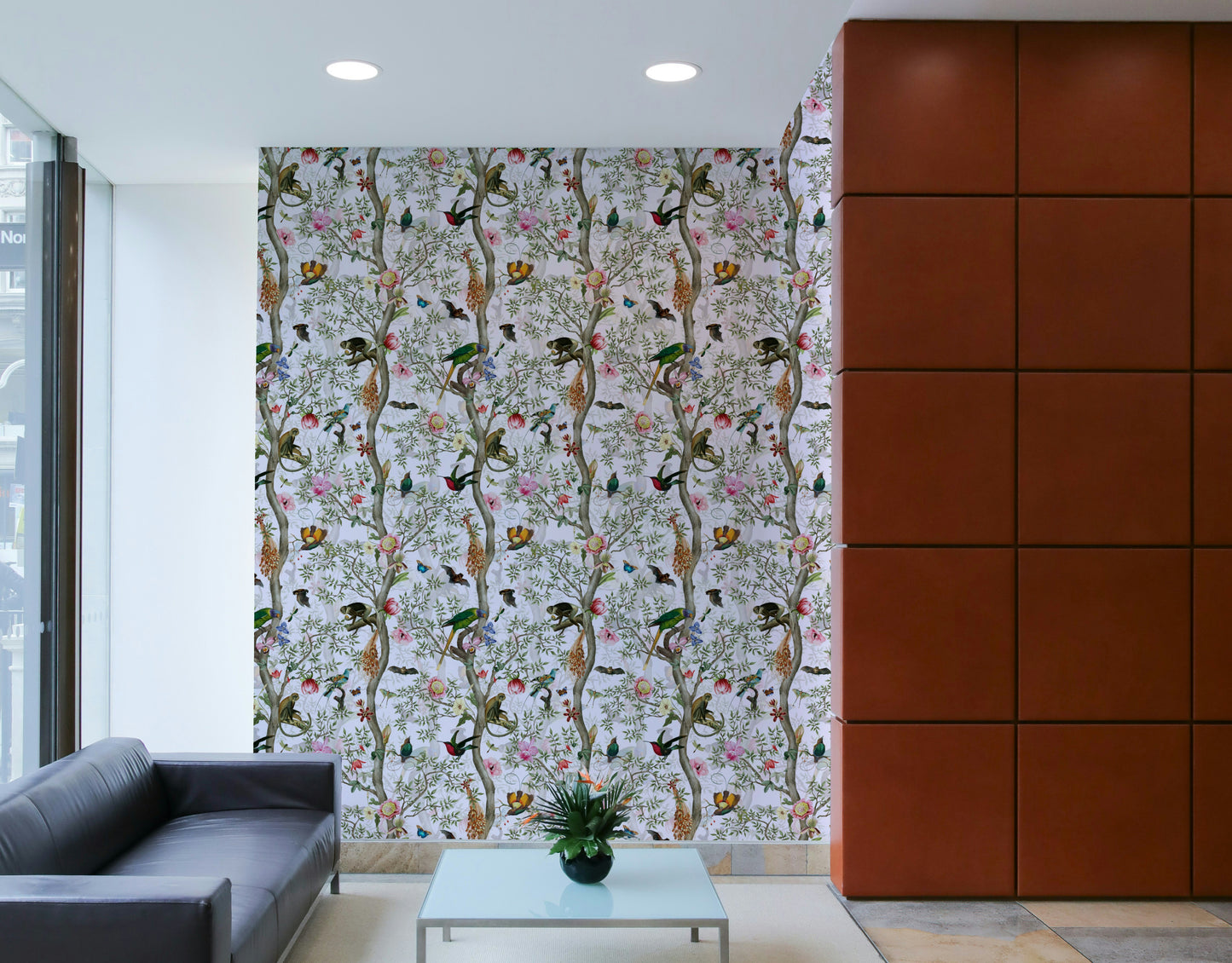 Subtle botanical wallpaper featuring leaves and muted floral accents.


