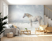 Snowdrift Horse wallpaper mural showing a white horse in snowfall behind a large cream sectional sofa in a living room