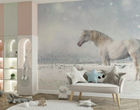 Snowdrift Horse wallpaper mural with a white horse in falling snow behind a cream loveseat in a pastel kids room