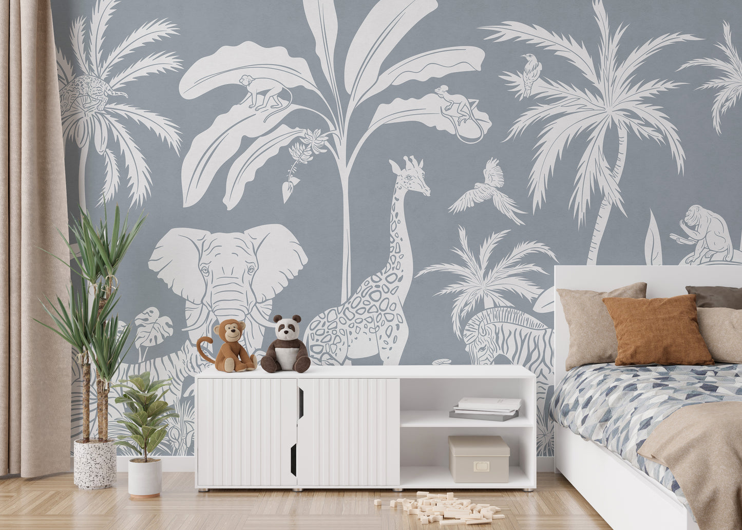 Self adhesive Monochrome Jungle Blue Wall Mural in a living space with a white console cabinet and green plants.
