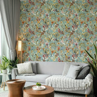 Bold teal meadow mural for a sophisticated studio workspace with velvet furniture.