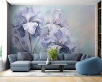 Wild Purple Iris wallpaper mural of painted purple irises behind a blue-gray sectional sofa in a living room