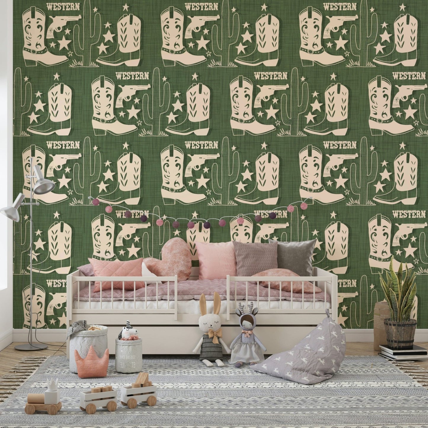 Rustic wallpaper mural with Western symbols including cowboy boots, pistols, and tall cacti.
