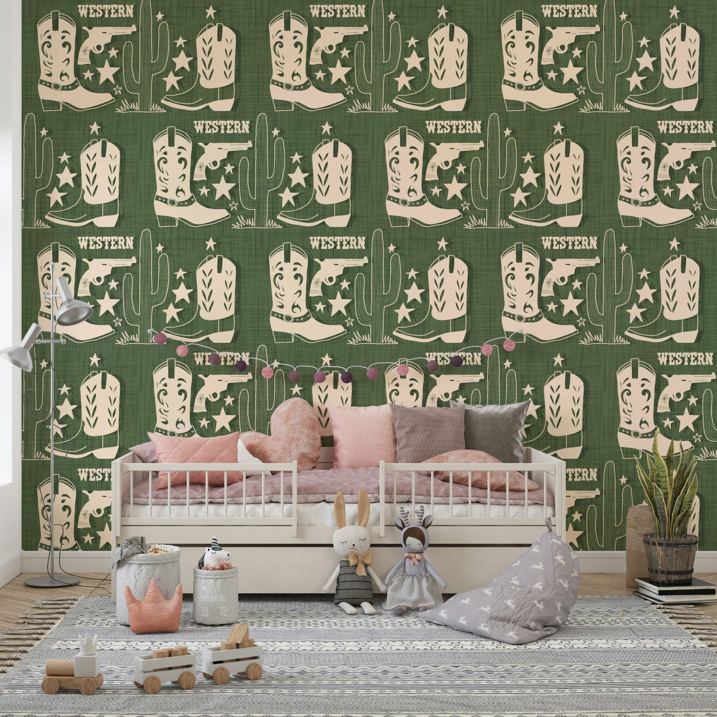 Rustic wallpaper mural with Western symbols including cowboy boots, pistols, and tall cacti.