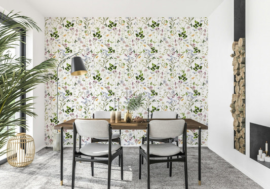 Wildflower Early Summer Meadow Wallpaper behind a tan leather lounge suite.